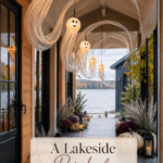 Lakeside Halloween entry with glowing gauze ghost lanterns sweeping overhead and a warm editorial title panel