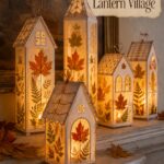 Pressed-leaf lantern fall village made of paper and vellum with tea lights on wood table