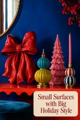 small holiday console display with bold ceramic decorations and warm headline panel