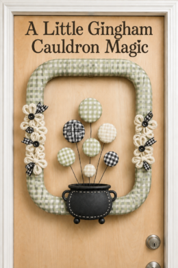 Rectangular gingham cauldron wreath with checked bubbles and button centered flowers beneath the words A Little Gingham Cauldron Magic