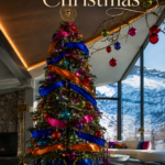 Modern Christmas lounge with a ribbon wrapped tree gold starburst topper and bowl of ornaments beneath text reading A Jewel Tone Christmas