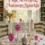 Sunlit breakfast library with pink glass acorn decor golden oak leaves and cream ribbon with text reading Pink Acorns and Autumn Sparkle