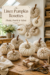 Vintage Linen Pumpkin Rosettes made of linen with velvet stems and vintage brooches securing the tops